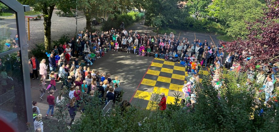 Supervising first graders and their parents at the welcome ceremony.
