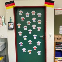 The classroom door was decorated with jerseys that the children had designed themselves.