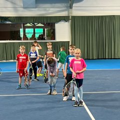 Children play tennis