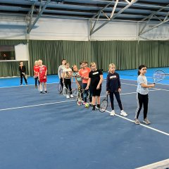 Children play tennis