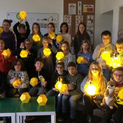 Fourth grade children with star lanterns