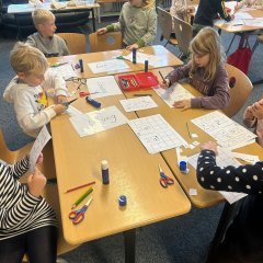 Children work at the dental health stations.