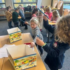 Children work at the dental health stations.