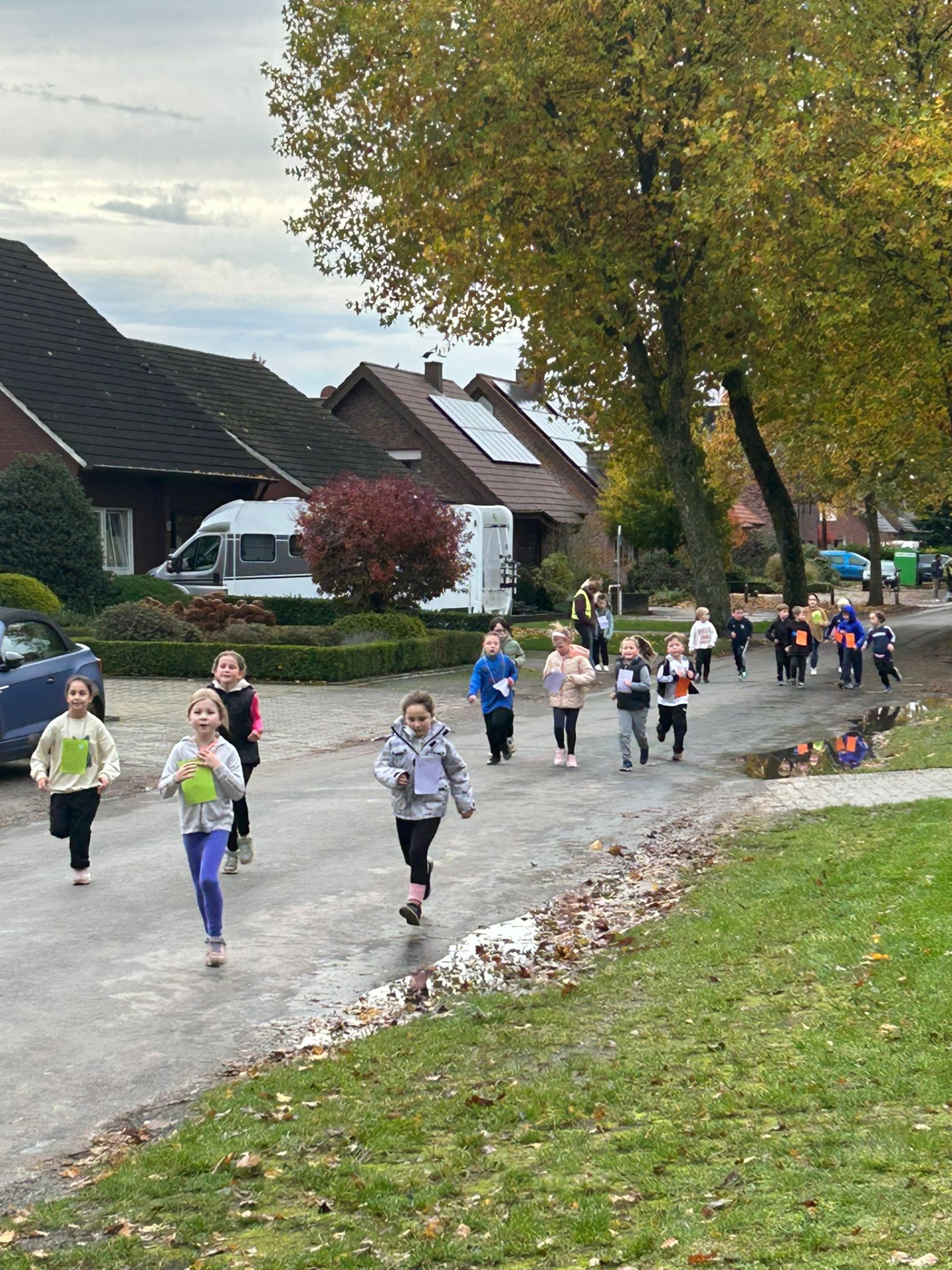 Children run on the track.