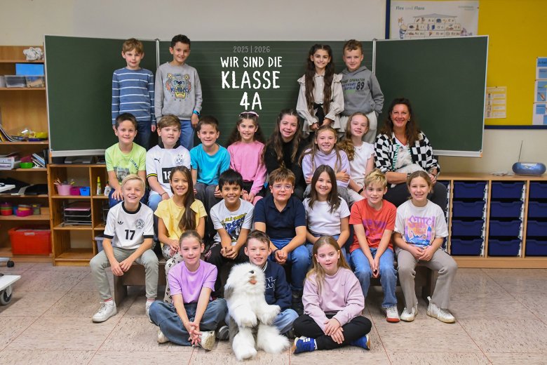 Children in the Paws class with their class teacher.